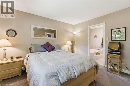 Carpeted bedroom with neutral wall tones and white trim - 26 Sideroad 18, Fergus, ON - Indoor Photo Showing Bedroom