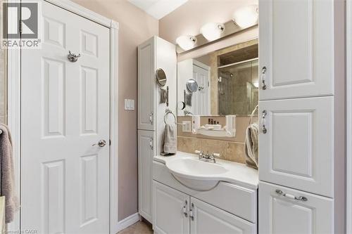 White paneled cabinetry and vanity with integrated sink - 26 Sideroad 18, Fergus, ON - Indoor