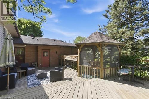 Expansive wood deck featuring a screened gazebo, brick exterior, and multiple access points - 26 Sideroad 18, Fergus, ON - Outdoor With Deck Patio Veranda With Exterior