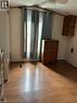 Wood-finish flooring throughout - 580 Beaver Creek Road Unit# 203, Waterloo, ON  - Indoor Photo Showing Other Room 