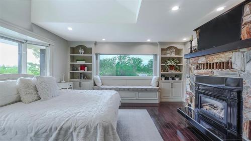 Primary Suite - 317 Pth 52 Highway W, Steinbach, MB - Indoor Photo Showing Bedroom With Fireplace