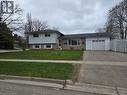 Split-level residence featuring a single-car garage and a paved driveway - 261 Overlea Drive, Kitchener, ON 