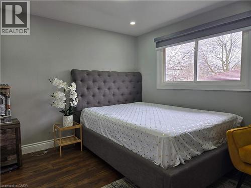 Recessed lighting illuminates this room featuring wood-finish flooring - 261 Overlea Drive, Kitchener, ON 
