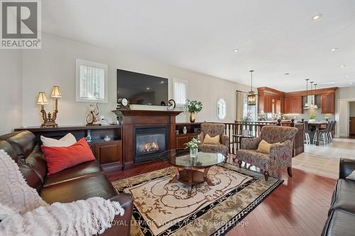 20 Bonniewood Drive, Mapleton, ON - Indoor Photo Showing Living Room With Fireplace