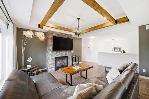 43 Seine River Crossing, Ste Anne, MB - Indoor Photo Showing Living Room With Fireplace