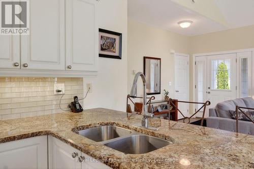 402 - 325 Densmore Road, Cobourg, ON - Indoor Photo Showing Kitchen With Double Sink