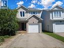 Two-story residence featuring a combination brick and siding exterior, an attached single-car garage, and a paved driveway - 732 Angler Way, Waterloo, ON  - Outdoor With Facade 