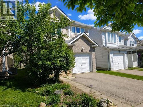 Front exterior featuring a single-car garage with an asphalt driveway - 732 Angler Way, Waterloo, ON - Outdoor