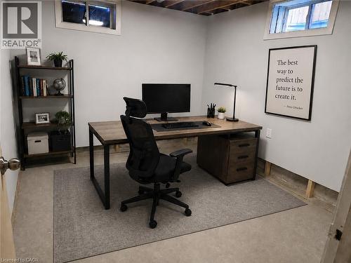 Interior room with painted light gray walls and concrete flooring - 732 Angler Way, Waterloo, ON - Indoor Photo Showing Office