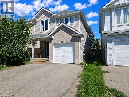 Two-story residence featuring light-colored siding and brick accents - 732 Angler Way, Waterloo, ON - Outdoor