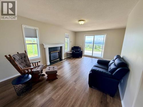 1037 Paradise Valley Subdivision, Dawson Creek, BC - Indoor Photo Showing Living Room With Fireplace