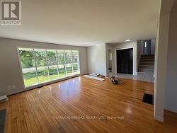 LARGE living room with hardwood floors - 