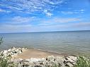 beach area - 2 Weeping Birch Avenue, Gimli Rm, MB  - Outdoor With Body Of Water With View 