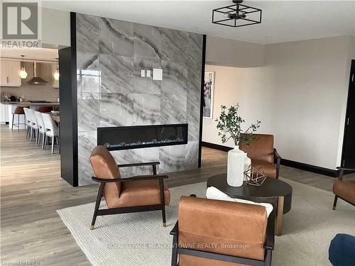 1304 - 15 Glebe Street E, Cambridge, ON - Indoor Photo Showing Living Room With Fireplace