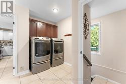 Mudroom Off the Garage Features a Laundry Room - 