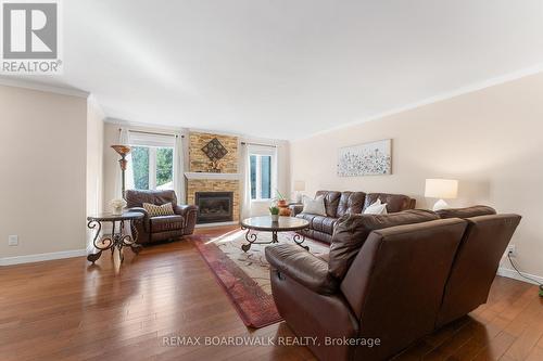 Living Room w/Gas Fireplace & Large Windows - 14 Panandrick View Drive, Ottawa, ON 