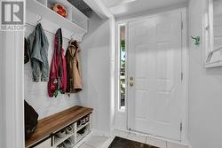 Spacious entry with built in bench. - 