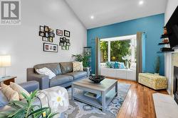 Family room with cathedral ceiling/pot lighting - 