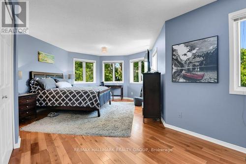 Primary bedroom has bay wall of windows. - 22 Terrace Drive, Ottawa, ON 
