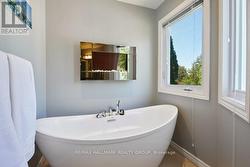 Romantic tub with accent fireplace - 