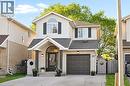 Two-story residence featuring light-toned brick and siding exterior - 214 Grey Fox Drive, Kitchener, ON 