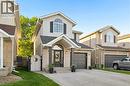 Two-story residence featuring light brick and siding exterior - 214 Grey Fox Drive, Kitchener, ON 