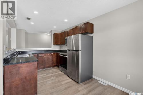 109 515 28Th Street E, Prince Albert, SK - Indoor Photo Showing Kitchen With Double Sink