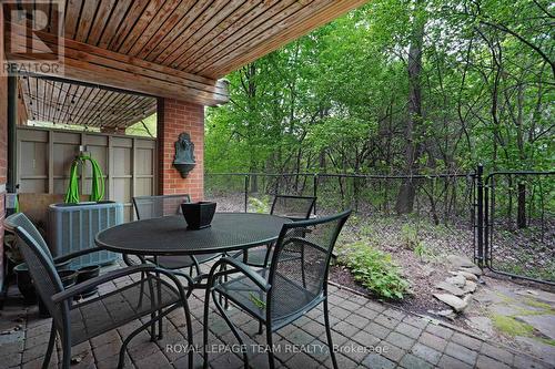 SHELTERED MAIN FLOOR PATIO FACES FOREST - 13 Oak Park Private, Ottawa, ON - Outdoor With Deck Patio Veranda