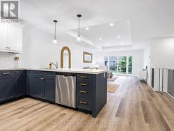 Kitchen with blue lower cabinets - 