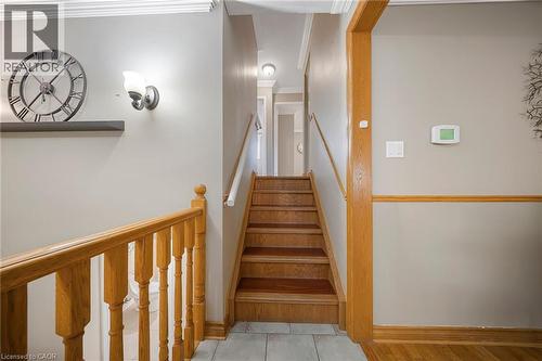 Wood-finish staircase with natural wood railings and balusters - 124 Dunsmere Drive, Kitchener, ON - Indoor Photo Showing Other Room