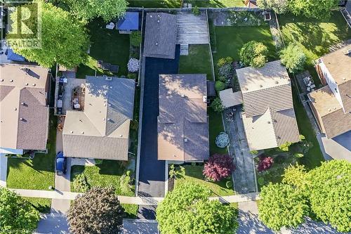 Aerial perspective showcasing a residential property with a multi-gabled roofline and a substantial driveway - 124 Dunsmere Drive, Kitchener, ON - Outdoor