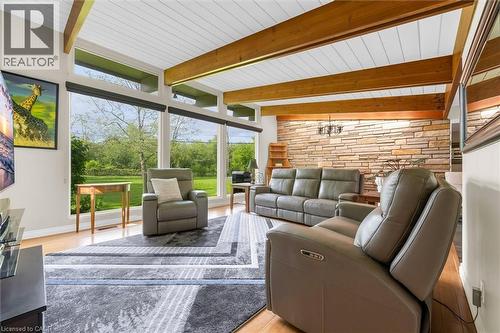 Vaulted ceiling with exposed wood beams and white paneling - 899 Niagara Parkway, Fort Erie, ON 