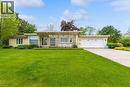 Mid-century modern exterior featuring stone veneer and horizontal siding - 899 Niagara Parkway, Fort Erie, ON 