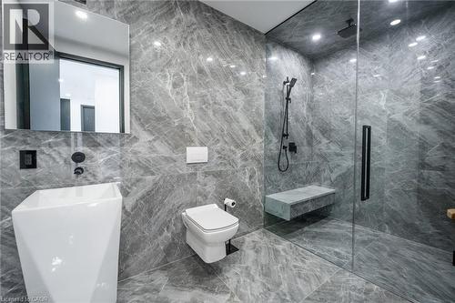 Contemporary bathroom featuring full-height stone-finish tiling - 6 Firelane 11A Street, Niagara-On-The-Lake, ON - Indoor Photo Showing Bathroom