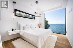 Expansive floor-to-ceiling window showcasing water scenery - 