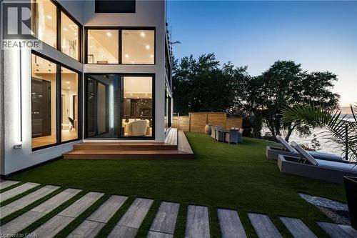 Expansive waterfront artificial turf lawn with stone paver pathway - 6 Firelane 11A Street, Niagara-On-The-Lake, ON -  Photo Showing Other Room