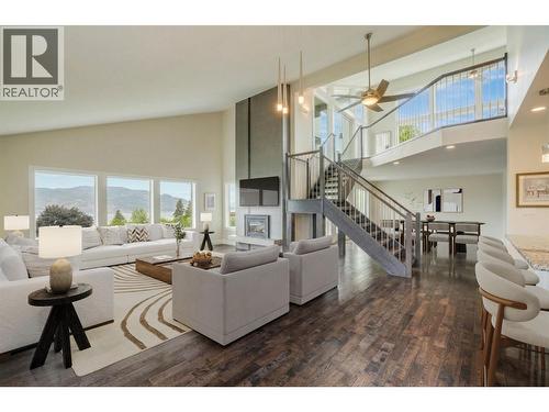 Spacious Living Room With Statement Fireplace And Soaring Ceilings ++Virtually Staged - 3137 Vector Drive, West Kelowna, BC 