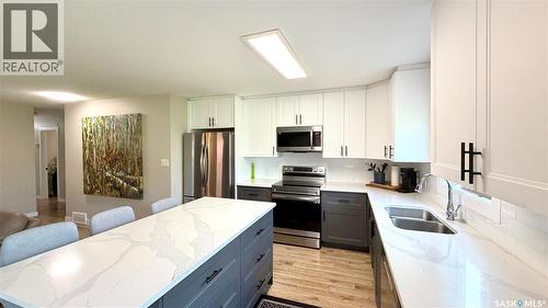 205 Ruby Drive, Coteau Rm No. 255, SK - Indoor Photo Showing Kitchen With Stainless Steel Kitchen With Double Sink