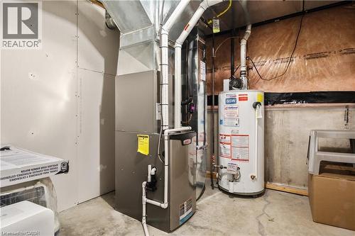 Utility room featuring furnace and water heater - 106 Moore Crescent, Ancaster, ON 
