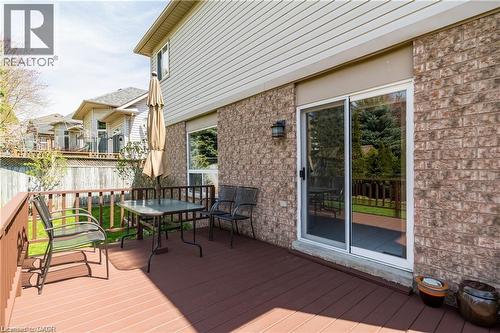 Expansive rear deck featuring wood-finish flooring and a wood railing - 106 Moore Crescent, Ancaster, ON 