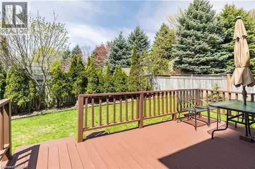 Spacious outdoor deck with a warm brown finish - 106 Moore Crescent, Ancaster, ON 