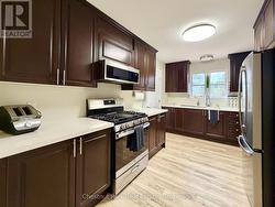 A ton of counter and cupboard space with... - 