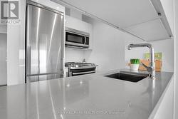 Impeccable quartz counters in kitchen - 