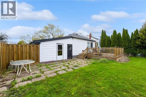 Expansive green lawn with a wood privacy fence and a spacious wood deck - 95 Dana Drive, Hamilton, ON 