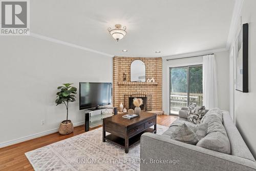 Family room with fireplace and walk out - 99 Abitibi Avenue, Toronto, ON 