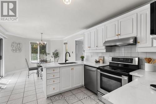 Sunlit eat-in kitchen with garden views - 99 Abitibi Avenue, Toronto, ON 