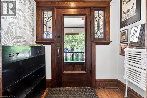 Hardwood entry door with leaded glass sidelights and transom - 35 Burris Street, Hamilton, ON - Indoor Photo Showing Other Room