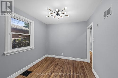 Dining room w window & modern fixture above. - 1246 Kitchener Avenue, Ottawa, ON 