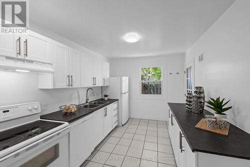 Kitchen space w window, light above & pantry space - 1246 Kitchener Avenue, Ottawa, ON 