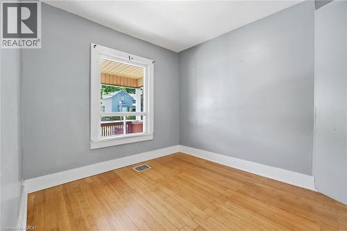 Interior room featuring light-toned wood flooring and a single window with white trim - 343 Cumberland Avenue, Hamilton, ON 